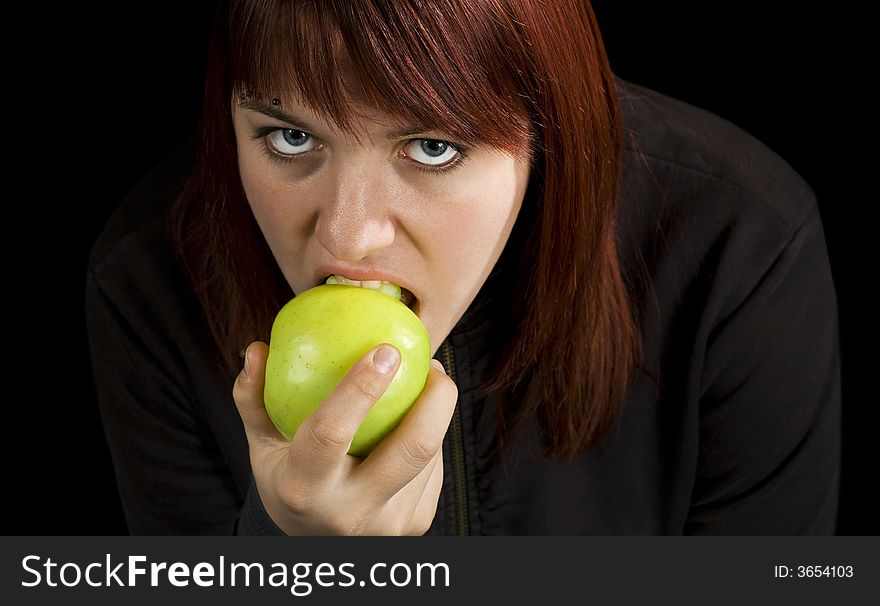 Girl eating delicious green apple