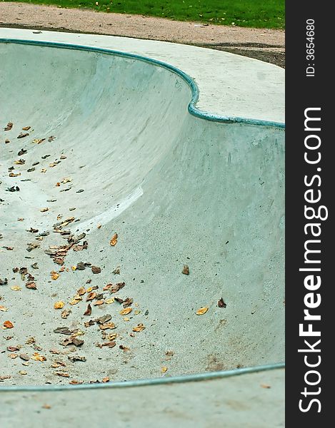 Concrete skate pool in the autumn with leaves