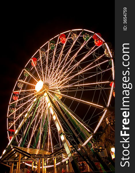Big ferris wheel with lights in the night