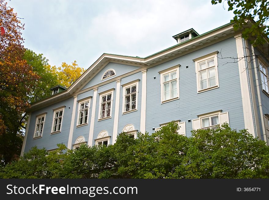 Light blue luxury wooden house in summertime