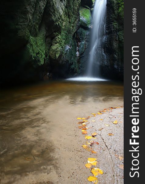 Waterfall and rock on autumn. Waterfall and rock on autumn