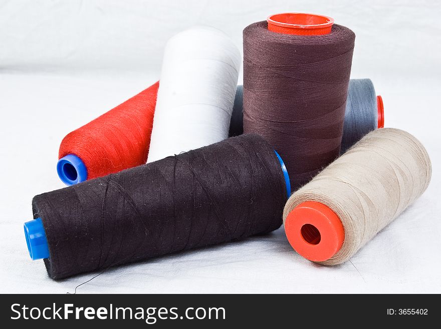 Thread spools on white background