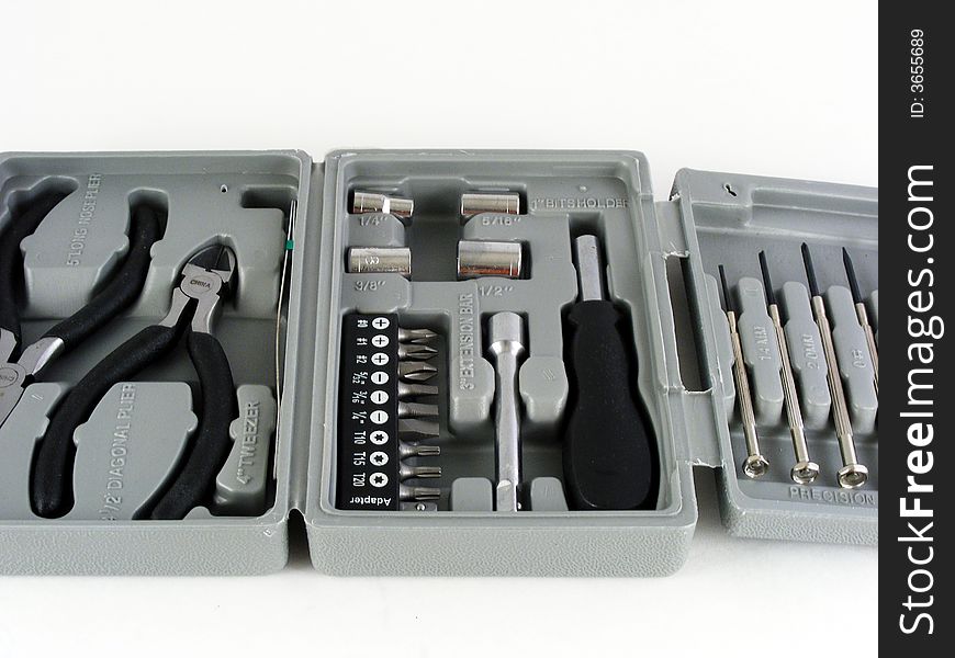 A small tool kit for home repairs against a white background. A small tool kit for home repairs against a white background.