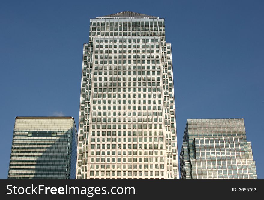 Canary Wharf office buildings with a clear blue sky background