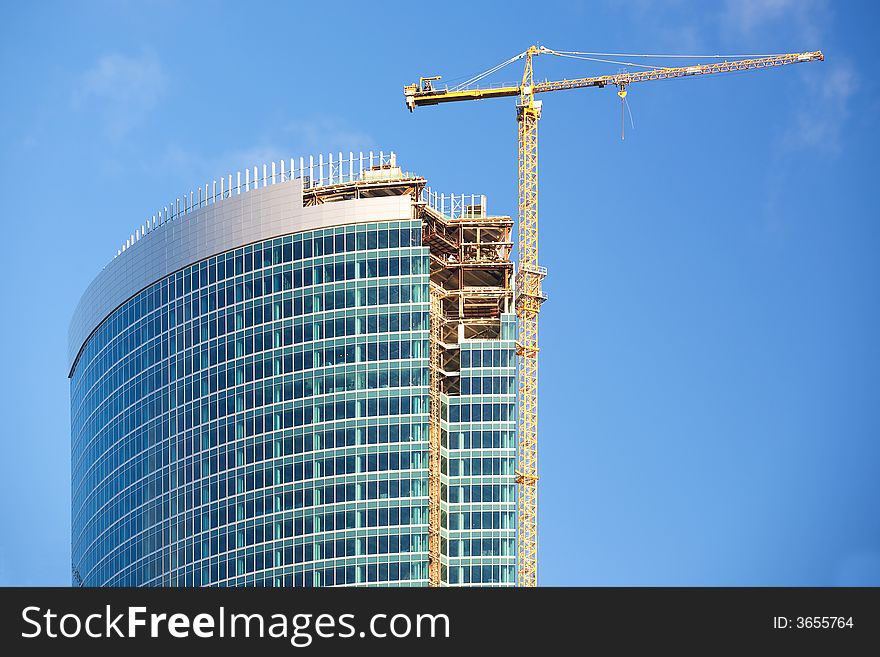 Construction of a skyscraper in Moscow, early morning. Construction of a skyscraper in Moscow, early morning