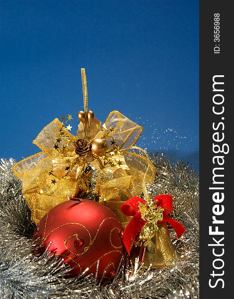 Christmas arrangement with red globe, golden bell and ribbon. Christmas arrangement with red globe, golden bell and ribbon