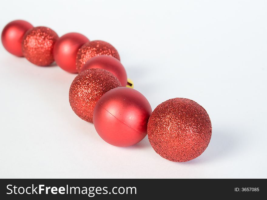 Red christmas globes line over white background. Red christmas globes line over white background