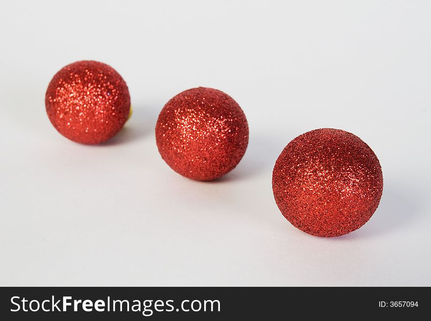 Isolated small red christmas globes over white background. Isolated small red christmas globes over white background