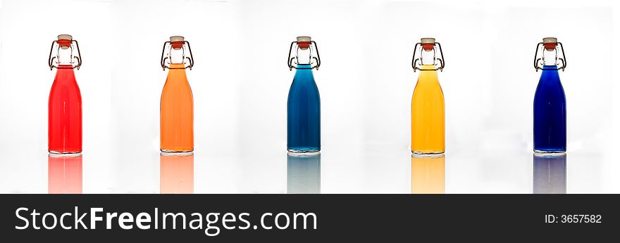 A selection of old styled bottles with swing top style of gaskets - with reflections. A selection of old styled bottles with swing top style of gaskets - with reflections