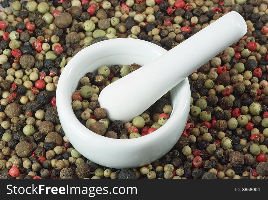 Close-up of pepper grains in four different colors. Close-up of pepper grains in four different colors