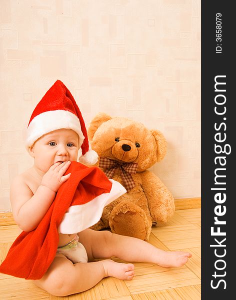 Adorable baby in Christmas hat. Adorable baby in Christmas hat