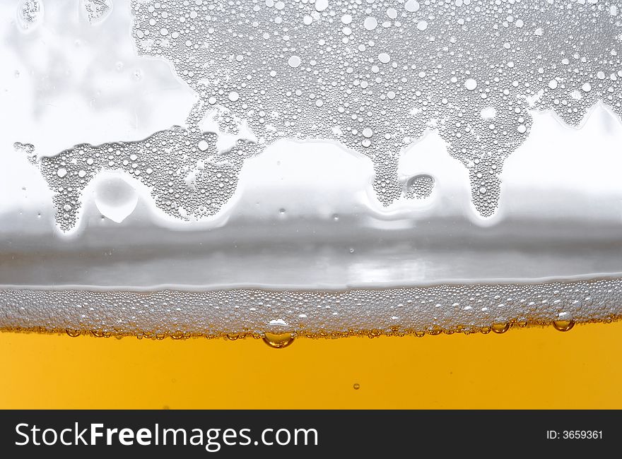 Beer in glass on the white background. Beer in glass on the white background
