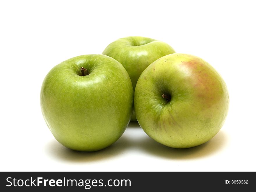 Green apples on the white background