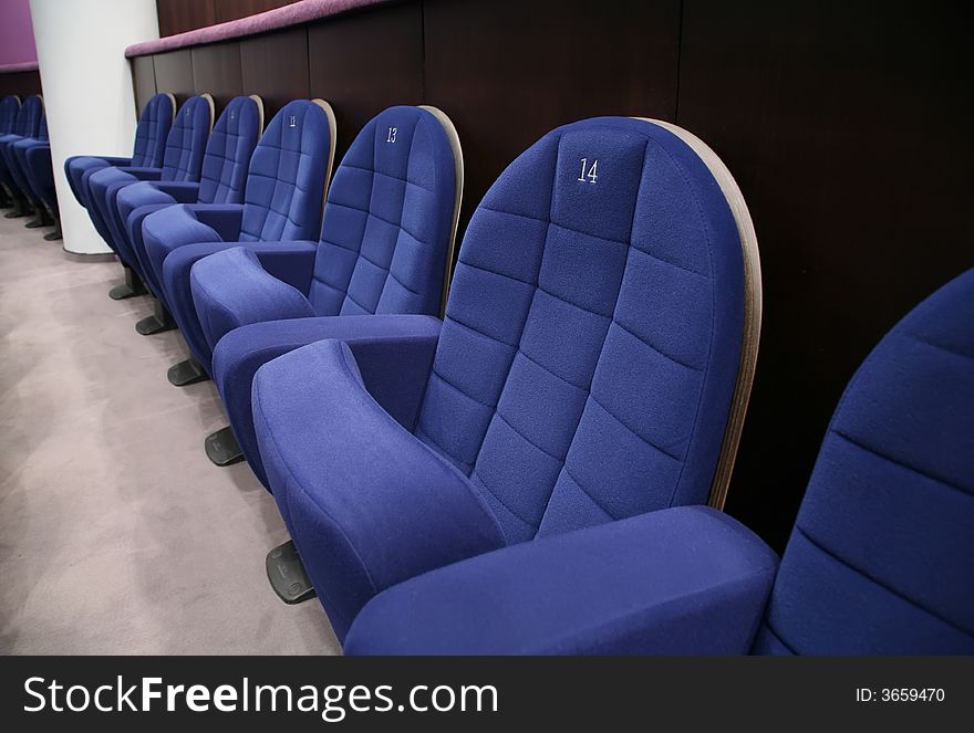 Row of blue theatre chairs