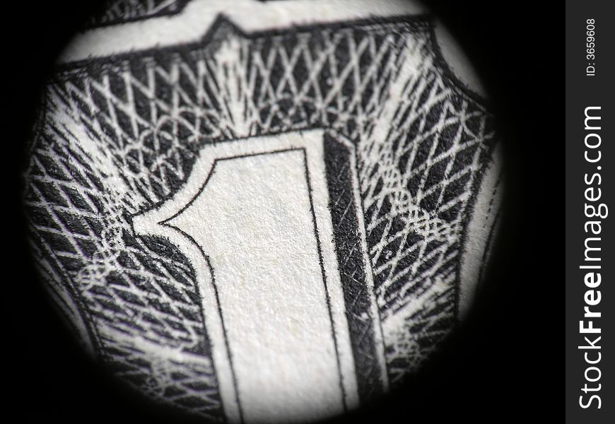 The one dollar close-up in the black framing