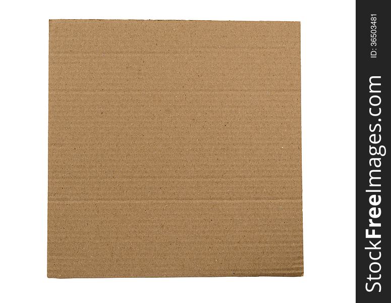 Brown corrugated cardboard isolated on a white background with lots of copy space. Brown corrugated cardboard isolated on a white background with lots of copy space.