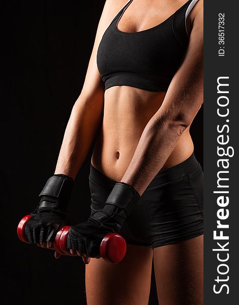 Woman Holding Red Dumbbells