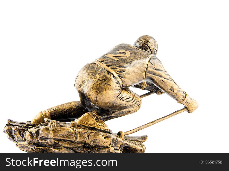 Gold ski champion statuette award isolated on white background