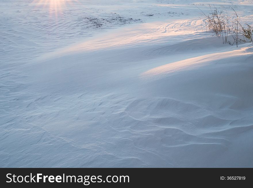 A snow drift background in an open field.