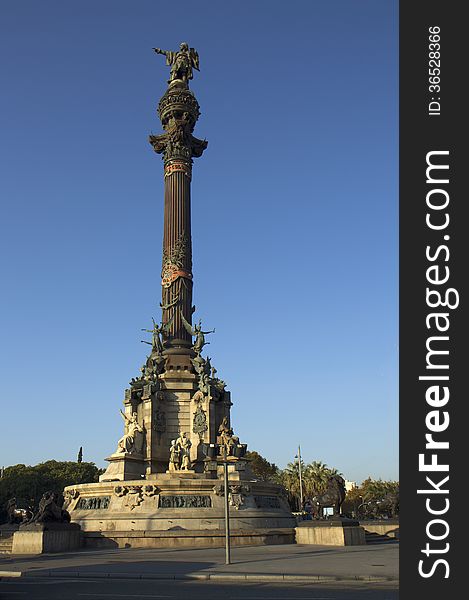 The 60-meter monument to Christopher Columbus, established at the end of La Rambla, on the Plaza Portal de La Pau. The monument towers over the centre of the city and the old port. The 60-meter monument to Christopher Columbus, established at the end of La Rambla, on the Plaza Portal de La Pau. The monument towers over the centre of the city and the old port.