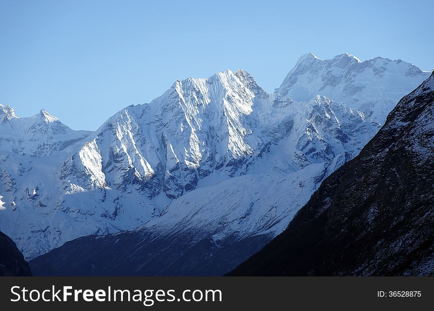 High mountains with steep slopes and snow peaks, Nepal, trek around the Manaslu. High mountains with steep slopes and snow peaks, Nepal, trek around the Manaslu