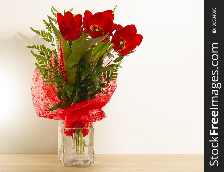 Bouquet red tulips green leaves wallpaper