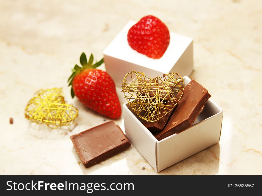 Strawberry and chocolate with heart shaped wire