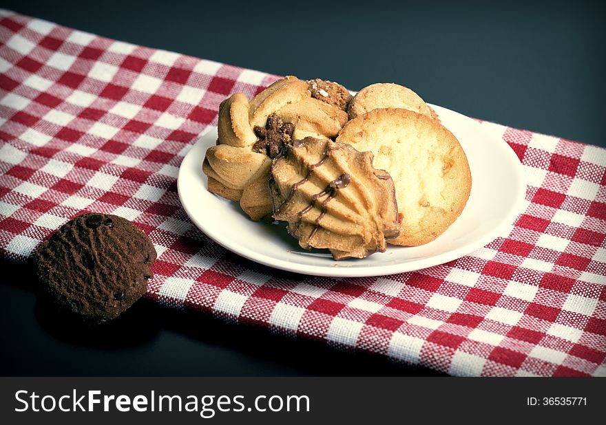 Mixed cookies on a white plate. Mixed cookies on a white plate