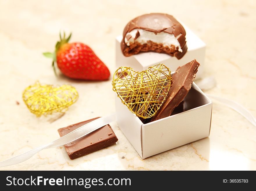 Strawberry and chocolate with heart shaped wire