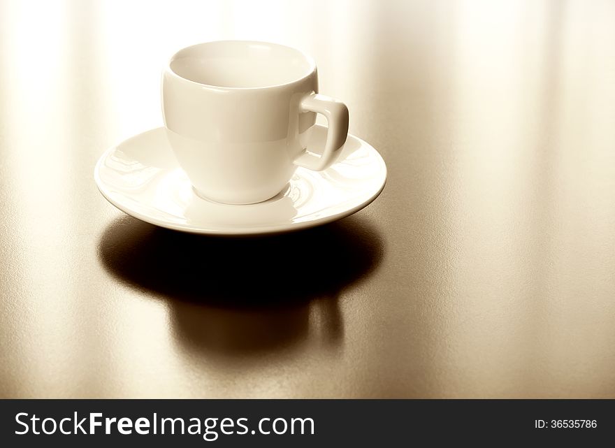 Espresso white cup and plate on table. Espresso white cup and plate on table