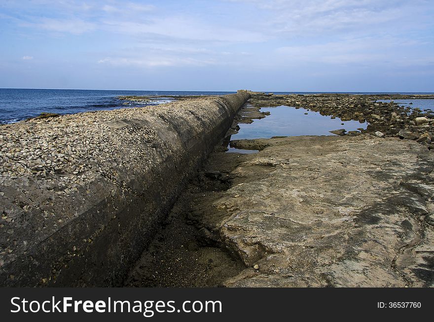 Sewage pipe having their outlet right into the sea pollution the water.