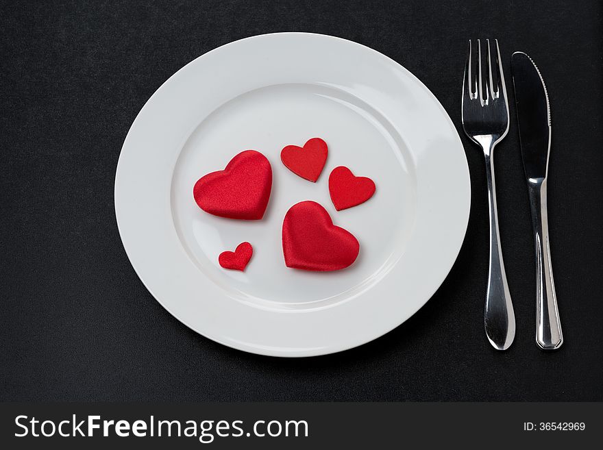 Festive table setting with red hearts, horizontal