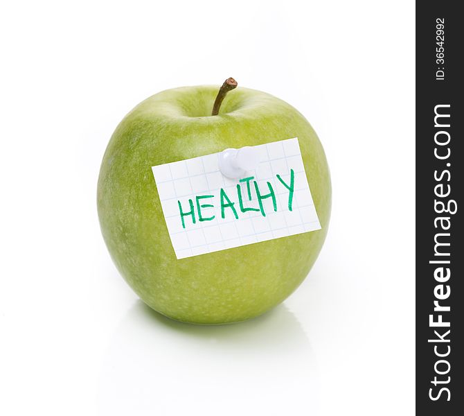 Green apple and label with the word healthy, isolated