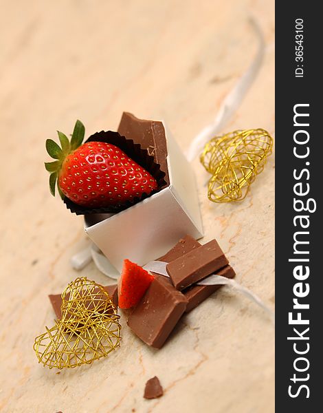 Strawberry and chocolate with heart shaped wire