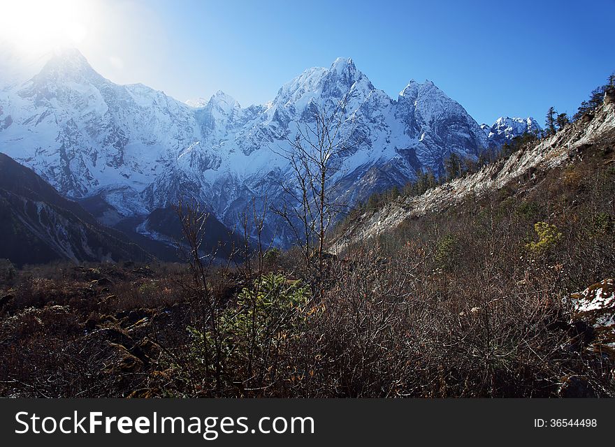 The sun in the snowy mountain peaks of Nepal, Himalayas