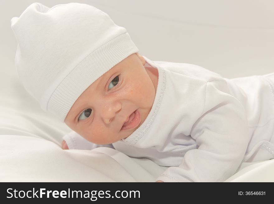 Baby in white a cap
