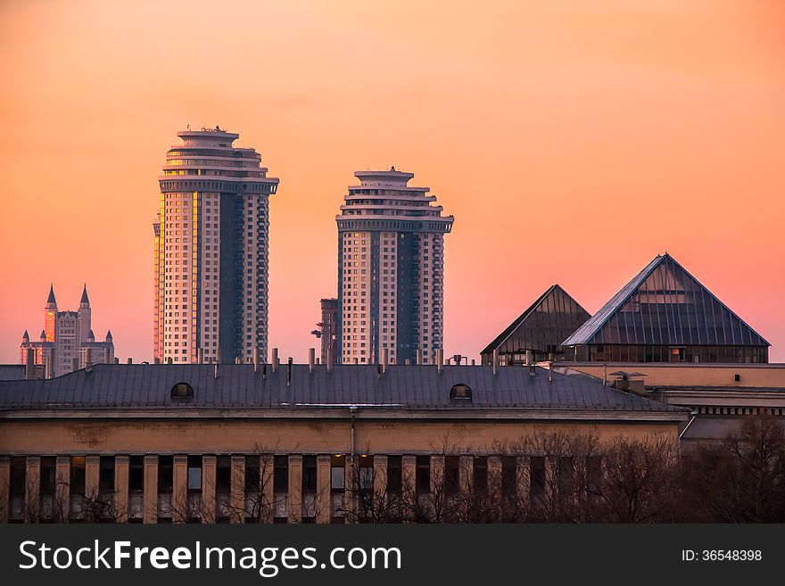 Sunset roofs in Moscow as an outlook from window to the urbanistic landscape.