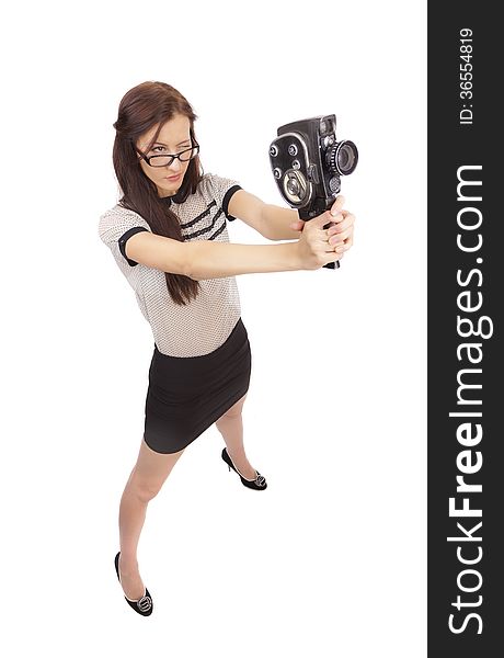 Girl with old movie camera on white background