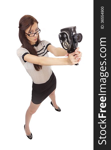 Girl with old movie camera on white background