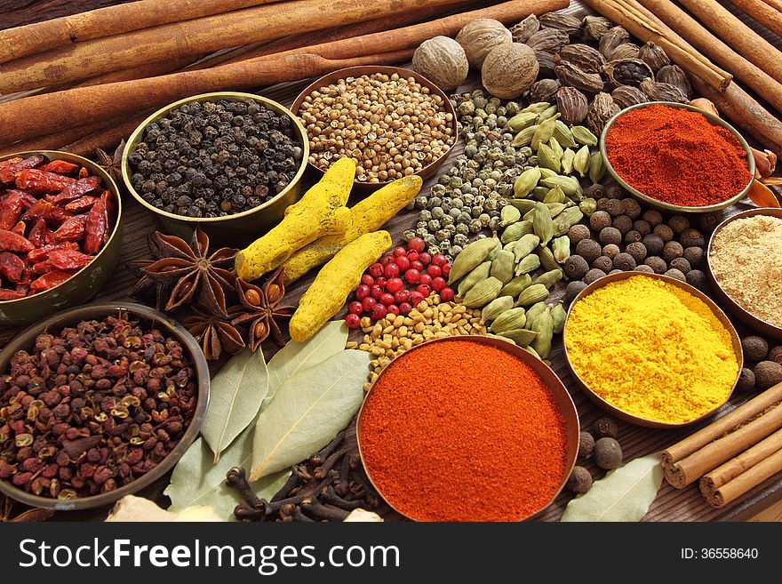 Spices and herbs in metal bowls. Food and cuisine ingredients. Spices and herbs in metal bowls. Food and cuisine ingredients.