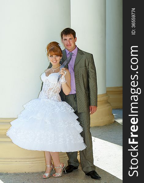 Beautiful charming bride short dress and happy groom. Beautiful charming bride short dress and happy groom