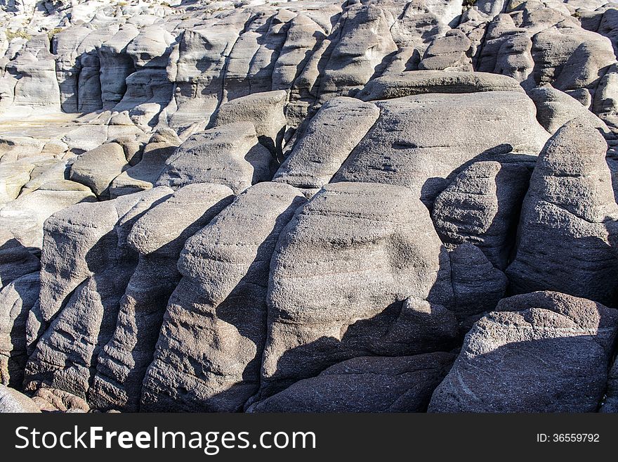 Along the west coast of Sardinia, the cliffs are silhouetted against the sea. Storm surges give special forms. Along the west coast of Sardinia, the cliffs are silhouetted against the sea. Storm surges give special forms.