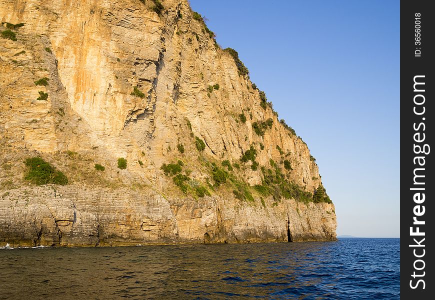 Huge sea rock formation by bright sunny evening. Huge sea rock formation by bright sunny evening