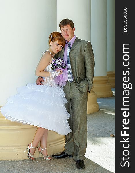 Beautiful charming bride short dress and happy groom. Beautiful charming bride short dress and happy groom