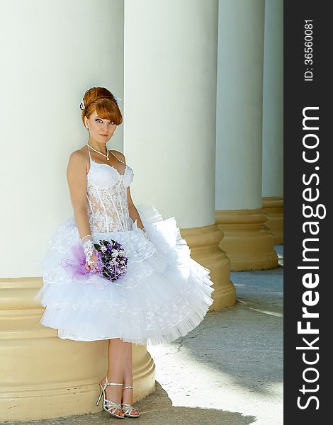 Beautiful redhead bride with big eyes on a sunny day. Beautiful redhead bride with big eyes on a sunny day