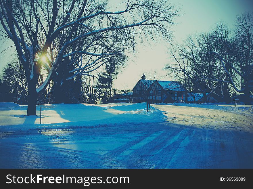 Winter landscape on the street with road and snow