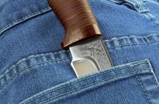 Knife In The Pocket Of Jeans Stock Photos