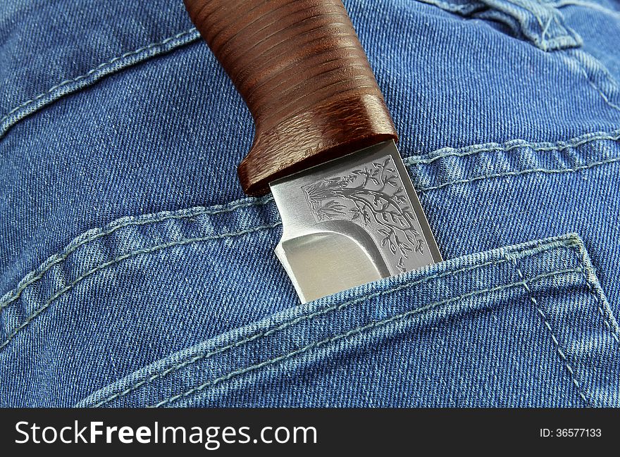 Knife in the pocket of jeans