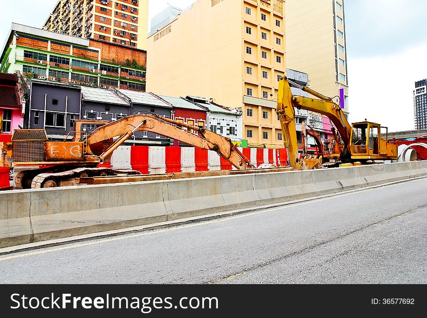 Excavators for road expansion traffic jam. Excavators for road expansion traffic jam