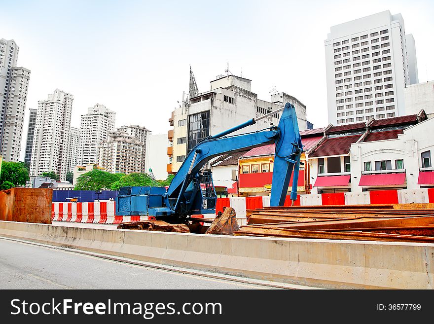 Excavators for road expansion traffic jam in the city. Excavators for road expansion traffic jam in the city